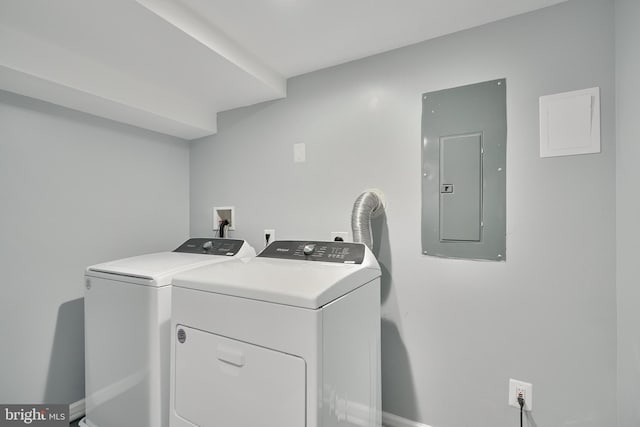 laundry area featuring washing machine and dryer and electric panel