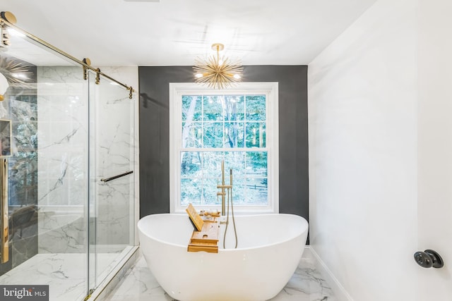 bathroom with a chandelier and plus walk in shower