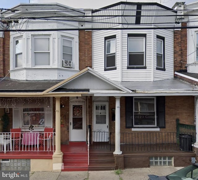 view of property with a porch