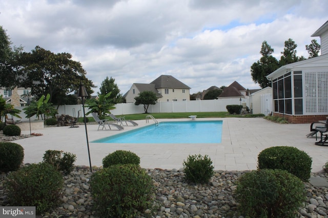 view of pool with a fenced backyard, a fenced in pool, and a patio