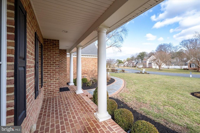 view of patio featuring a porch and a residential view