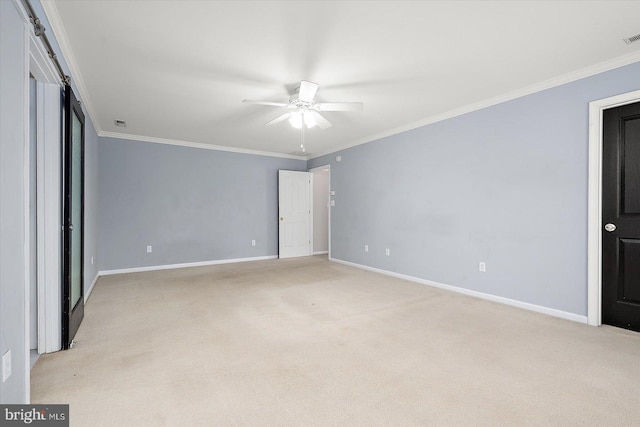 unfurnished bedroom with visible vents, ornamental molding, a ceiling fan, light carpet, and baseboards