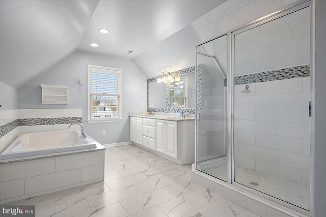 bathroom with vaulted ceiling, marble finish floor, a stall shower, and a garden tub