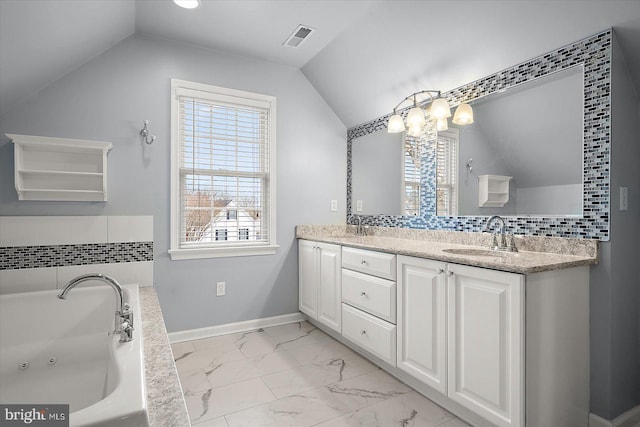 bathroom with plenty of natural light, marble finish floor, visible vents, and a sink