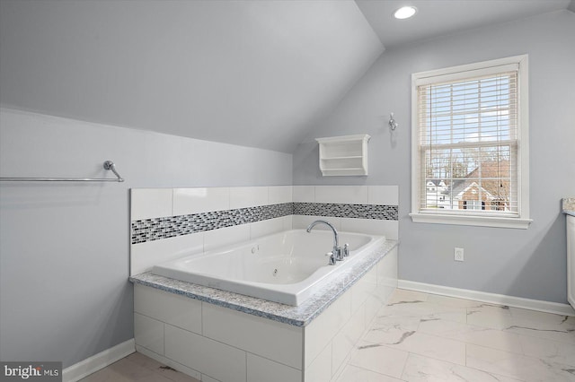 bathroom featuring recessed lighting, baseboards, vaulted ceiling, marble finish floor, and a whirlpool tub