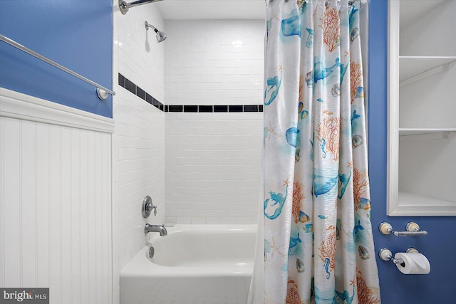 bathroom with shower / bath combo with shower curtain