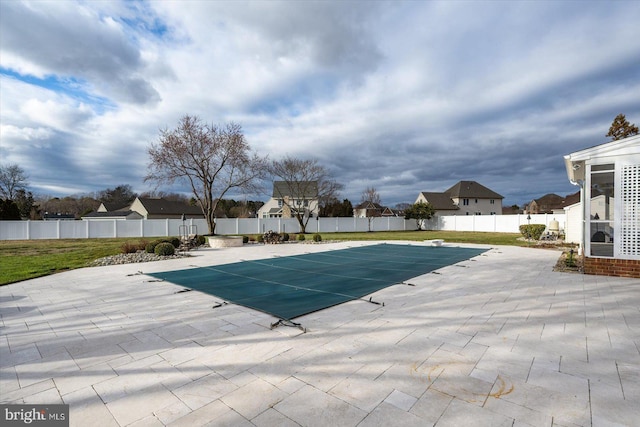 view of swimming pool with a patio area, a fenced backyard, and a fenced in pool