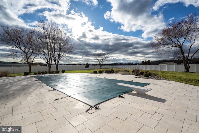 view of pool featuring a patio area, a fenced backyard, and a fenced in pool