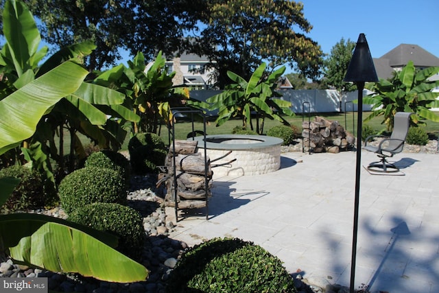 view of community featuring a patio area and fence