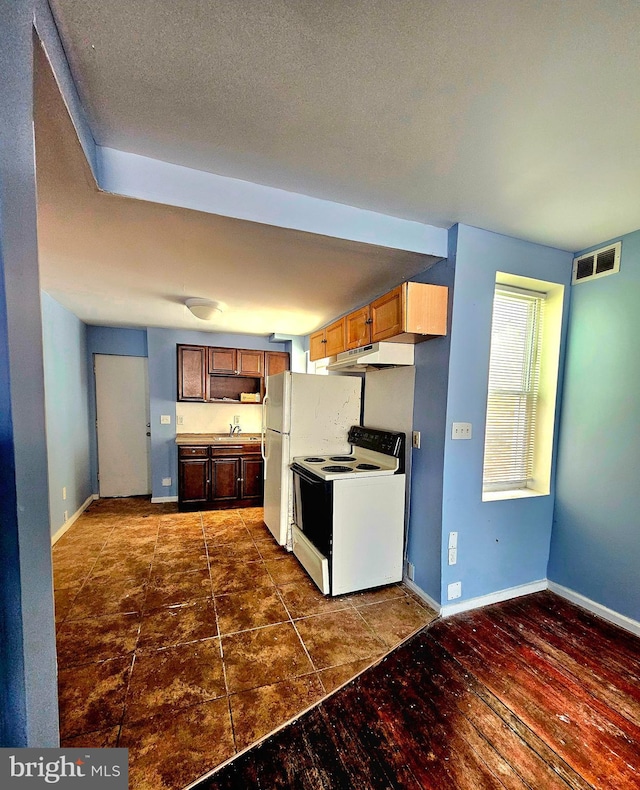 kitchen with a textured ceiling, white electric range, dark wood-type flooring, and sink