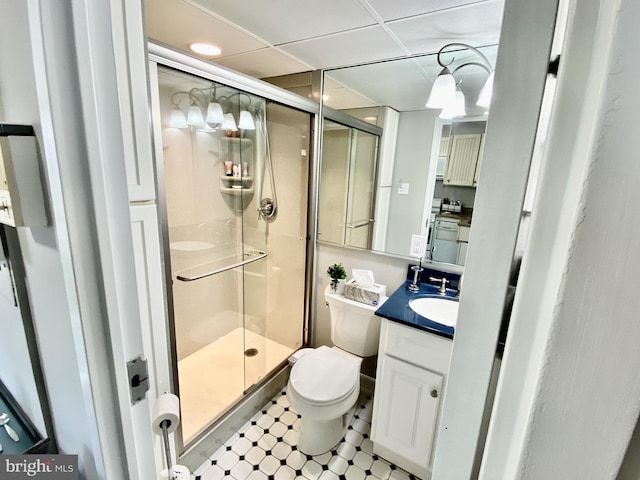 full bathroom with a shower stall, vanity, and toilet