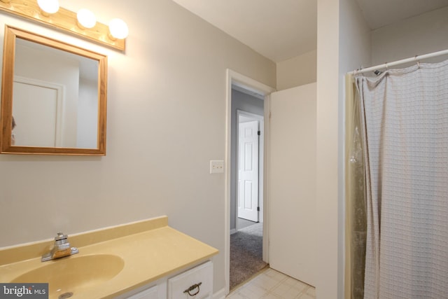 bathroom with vanity and a shower with shower curtain