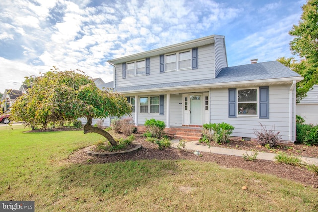 front facade featuring a front yard