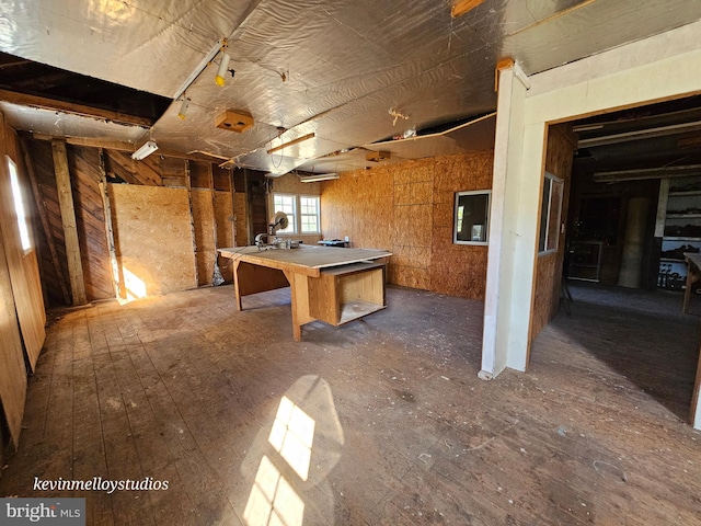 interior space featuring wood walls