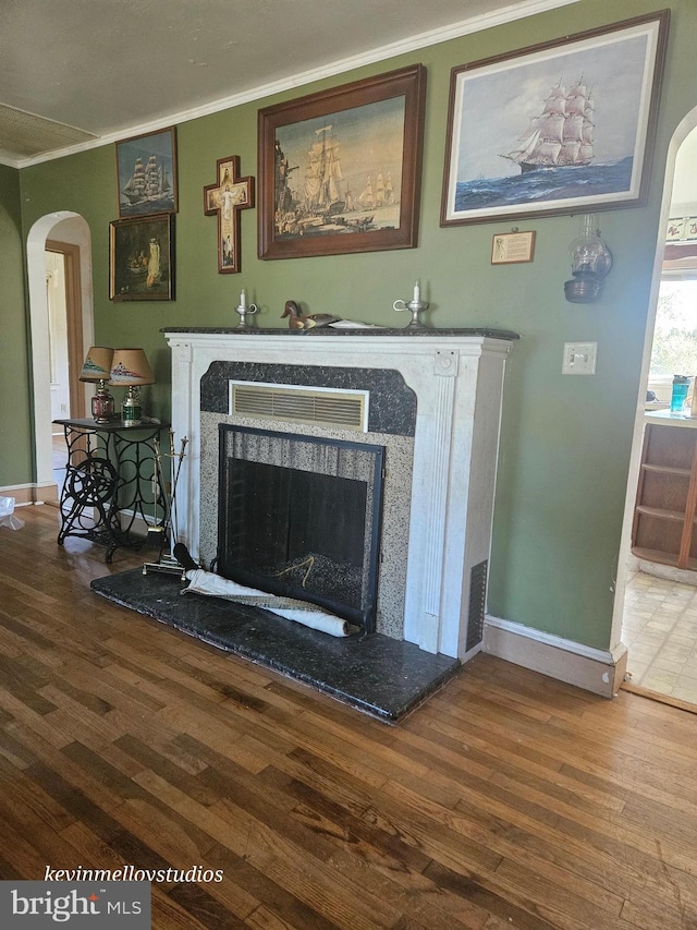 room details featuring ornamental molding and hardwood / wood-style flooring