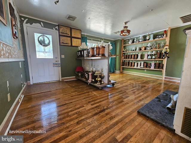 entryway with hardwood / wood-style flooring