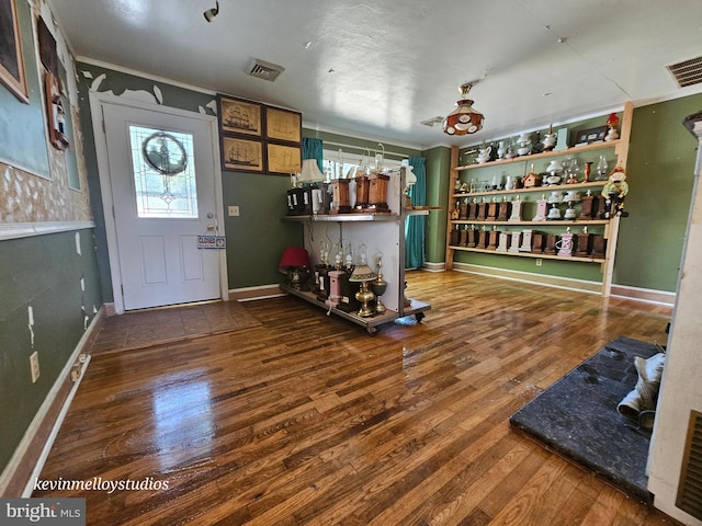 foyer entrance featuring hardwood / wood-style floors