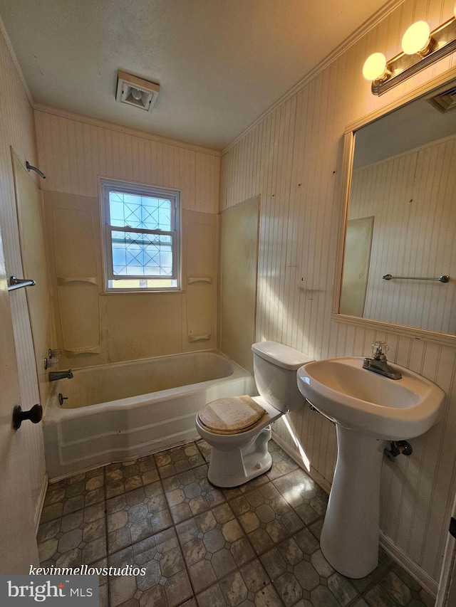 bathroom with toilet and shower / bathing tub combination