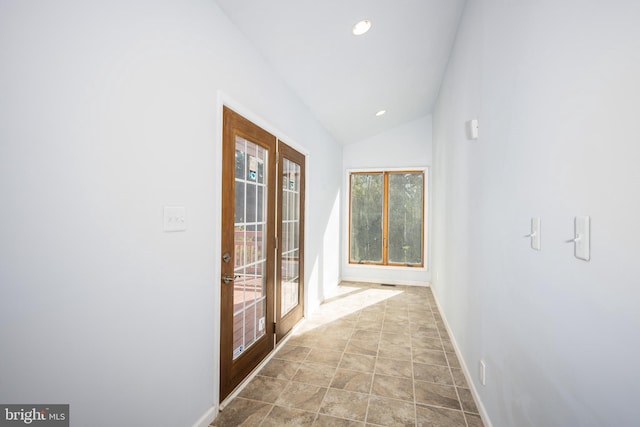 hall featuring french doors and lofted ceiling