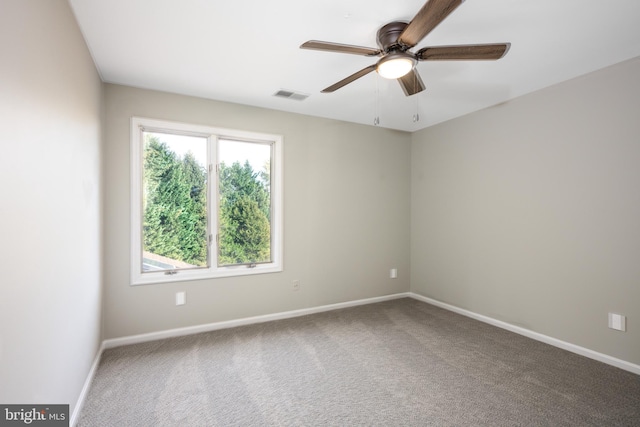 carpeted empty room with ceiling fan