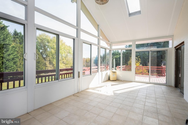 unfurnished sunroom featuring a wealth of natural light and vaulted ceiling