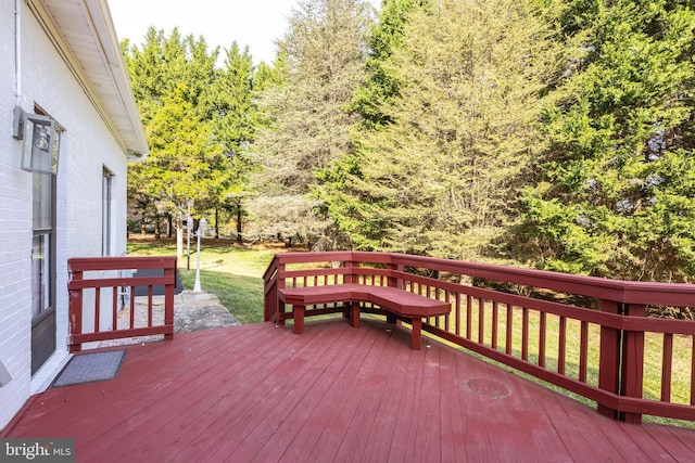 wooden deck with a yard