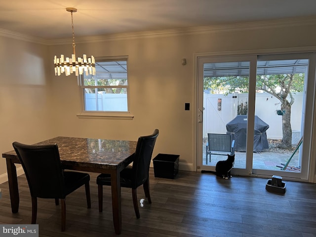 dining room featuring ornamental molding, a notable chandelier, and dark hardwood / wood-style floors