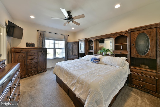 bedroom featuring dark carpet and ceiling fan