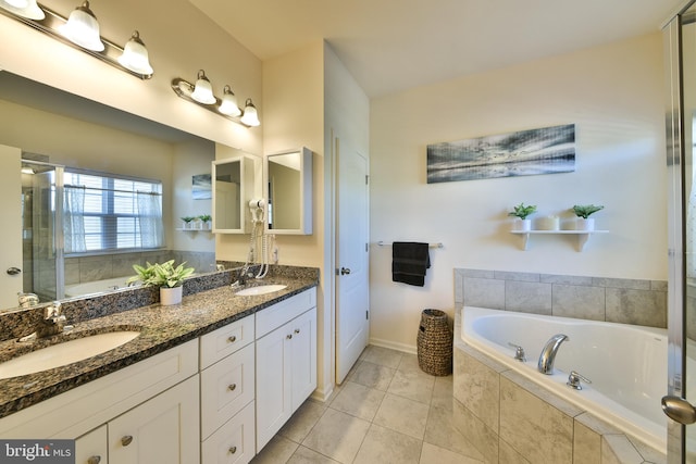 bathroom with vanity, shower with separate bathtub, and tile patterned flooring