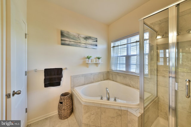 bathroom featuring independent shower and bath and tile patterned floors