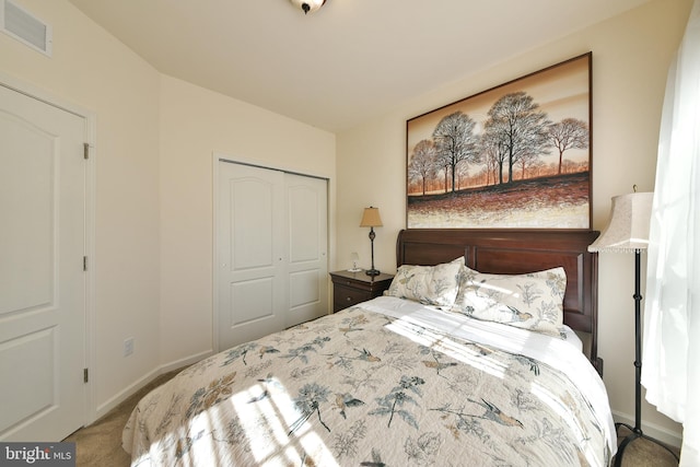 bedroom with a closet and carpet floors