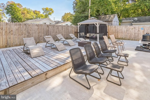 wooden deck featuring outdoor lounge area and a gazebo