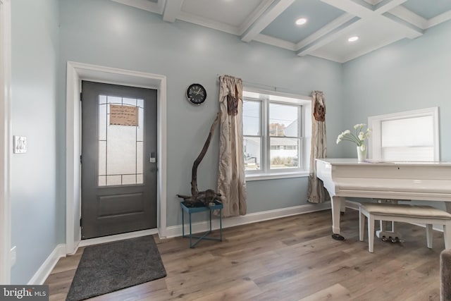 foyer with beamed ceiling, hardwood / wood-style flooring, and coffered ceiling