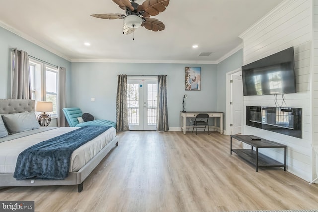 bedroom with access to exterior, french doors, ornamental molding, ceiling fan, and light hardwood / wood-style flooring