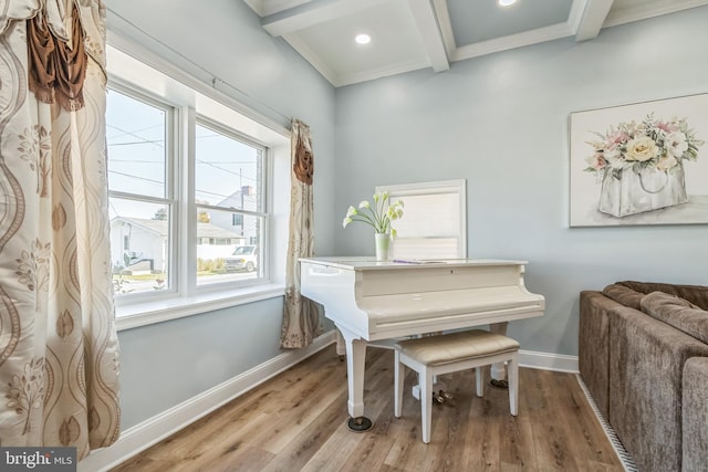 misc room featuring beamed ceiling, wood-type flooring, and ornamental molding