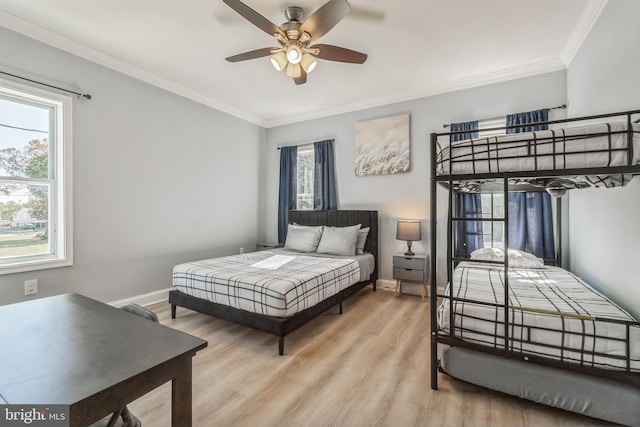 bedroom featuring light wood-type flooring, ceiling fan, and ornamental molding