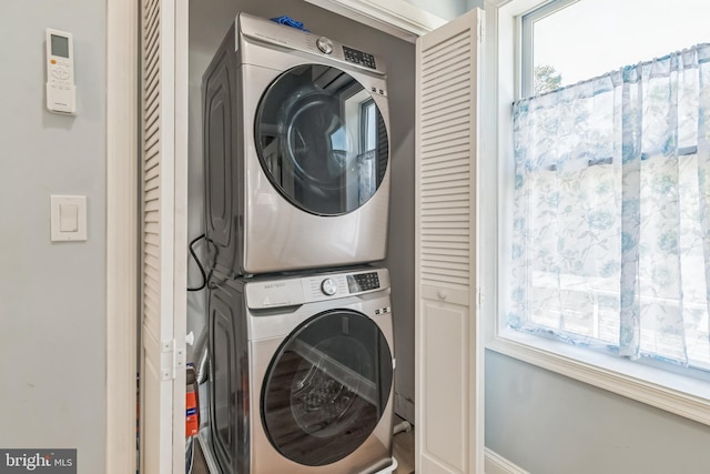 washroom with stacked washer / drying machine