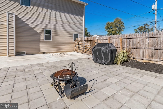 view of patio / terrace featuring area for grilling and a fire pit