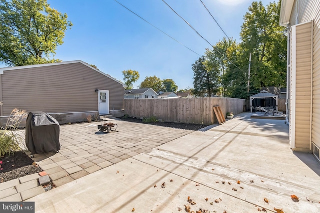 view of patio / terrace featuring a fire pit