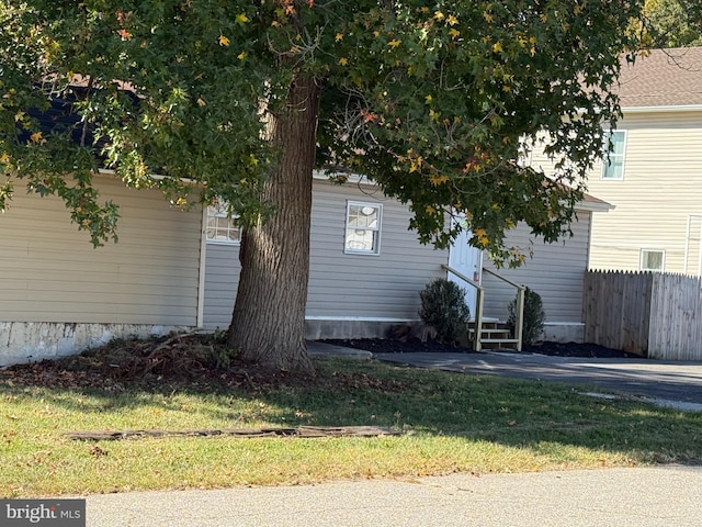 view of home's exterior with a yard