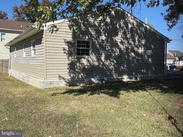 view of property exterior featuring a yard