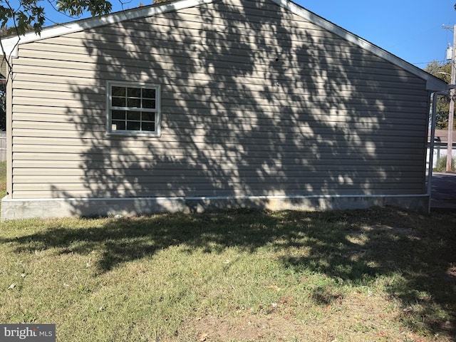 view of property exterior with a yard