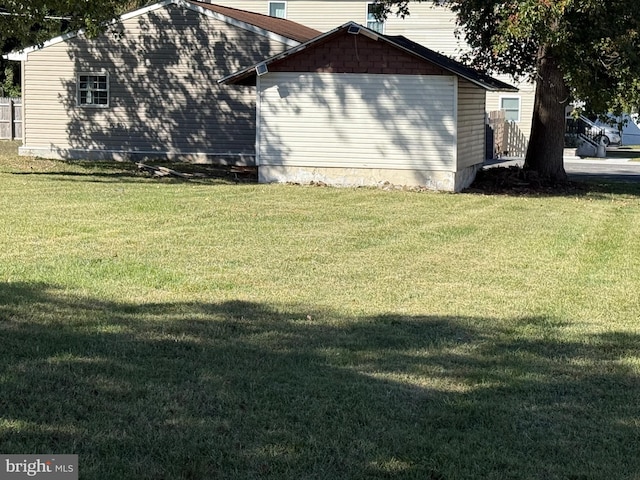 view of property exterior with a lawn