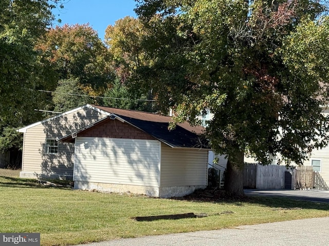 view of home's exterior featuring a yard