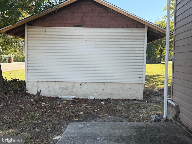 garage featuring a yard