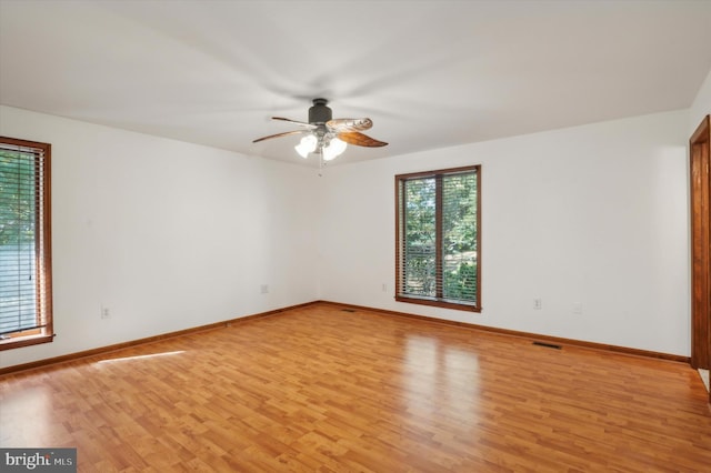 empty room featuring ceiling fan and light wood-type flooring