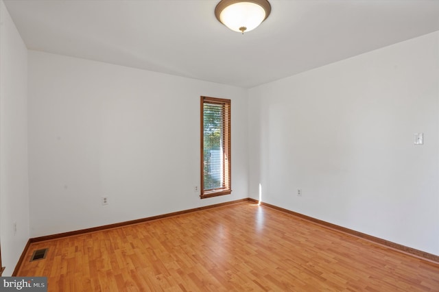 unfurnished room featuring light wood-type flooring