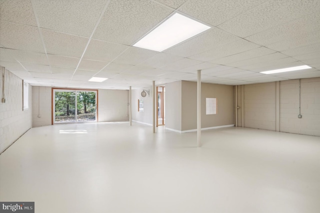 basement featuring a drop ceiling