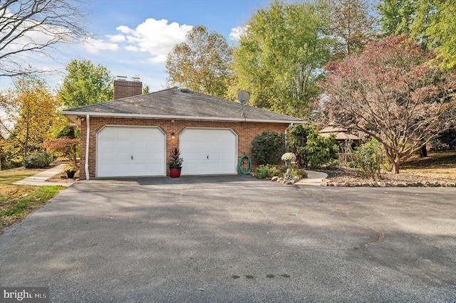 view of side of home with a garage