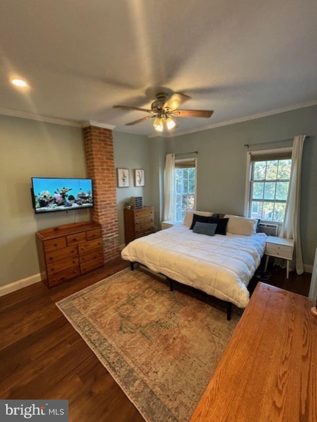 bedroom featuring dark hardwood / wood-style flooring, multiple windows, ornamental molding, and ceiling fan